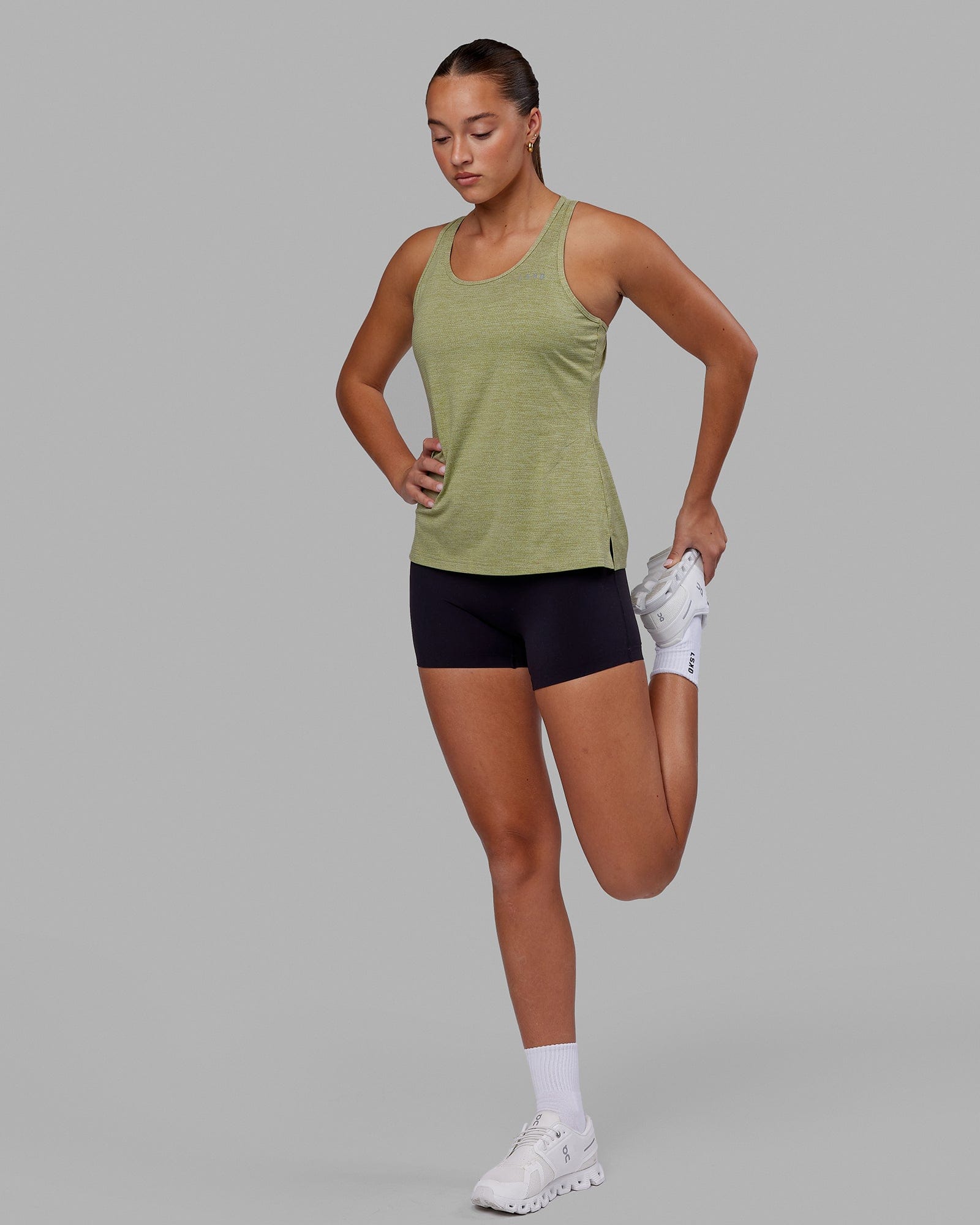 Woman wearing Perform VapourFLX Tank - Moss Stone Marl