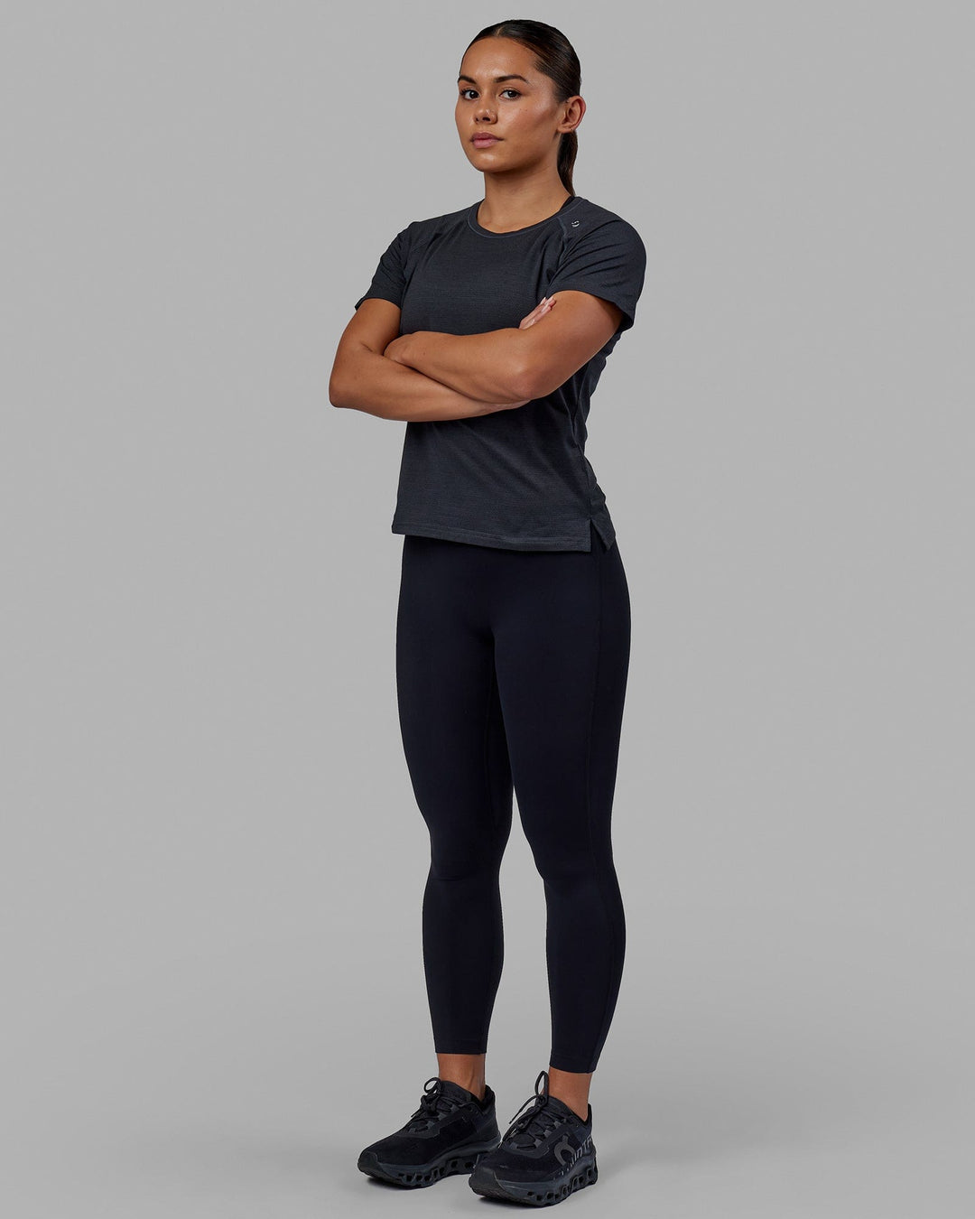 Woman wearing Perform VapourFLX Tee - Black Marl