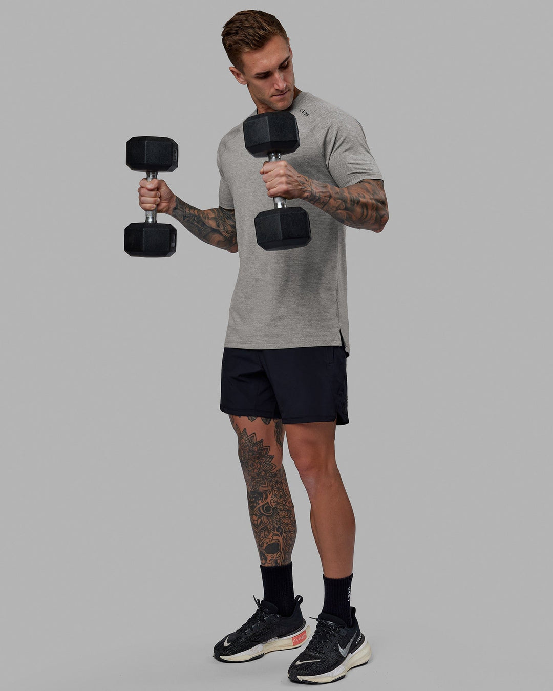 Man wearing Perform VapourFLX Tee - Lt Grey Marl