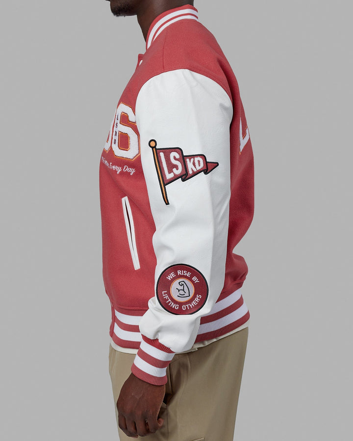 Man wearing Unisex Varsity Bomber Jacket - Mineral Red