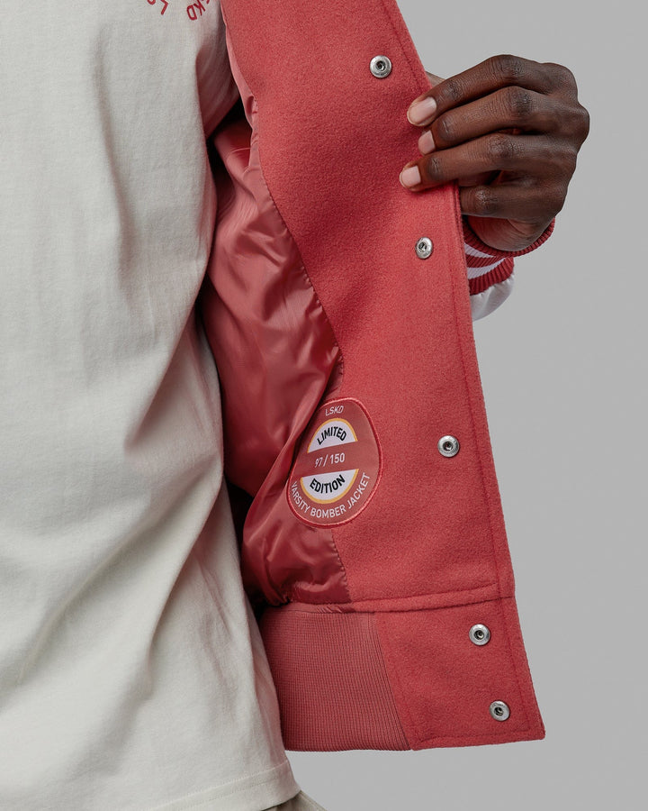 Man wearing Unisex Varsity Bomber Jacket - Mineral Red