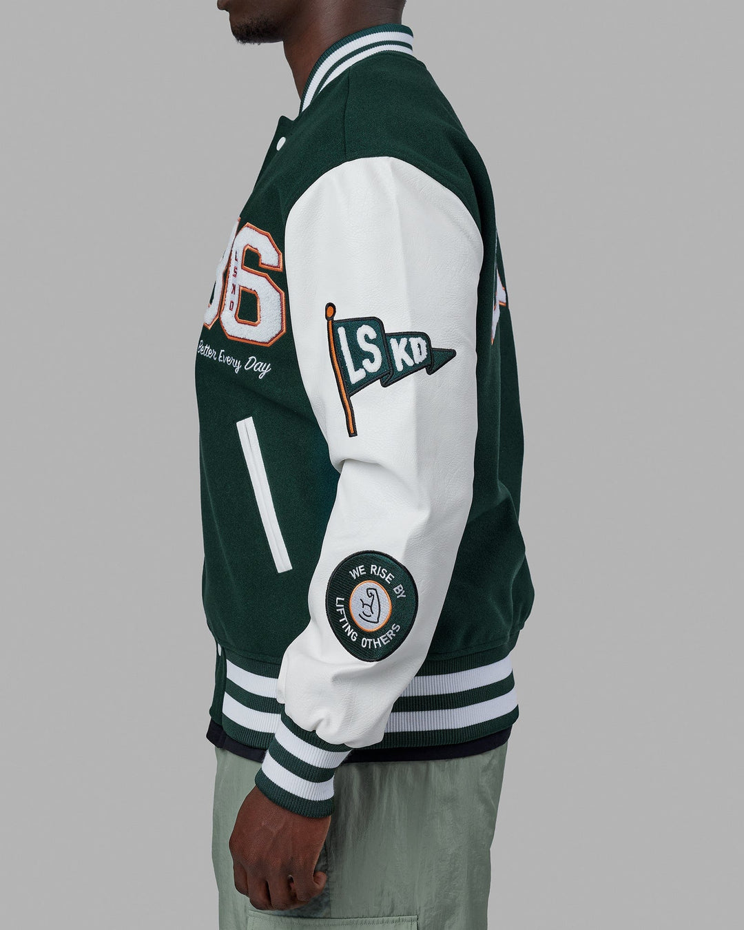 Man wearing Unisex Varsity Bomber Jacket - Vital Green