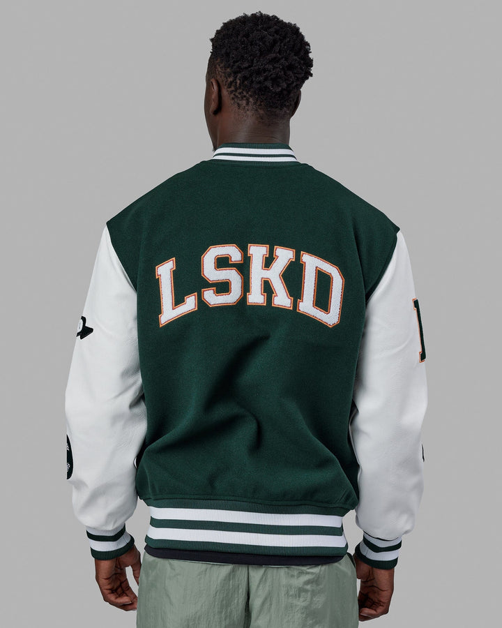 Man wearing Unisex Varsity Bomber Jacket - Vital Green