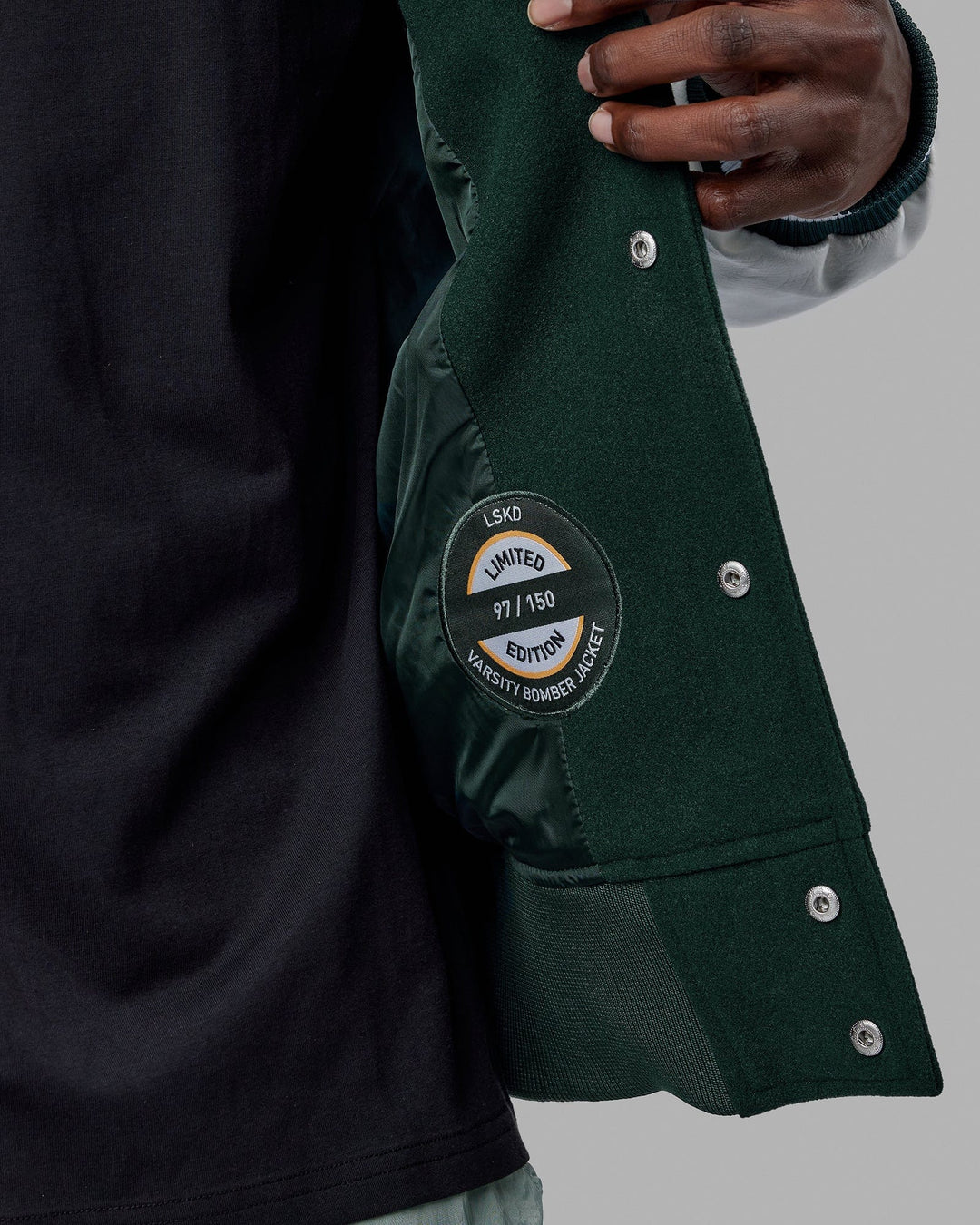 Man wearing Unisex Varsity Bomber Jacket - Vital Green