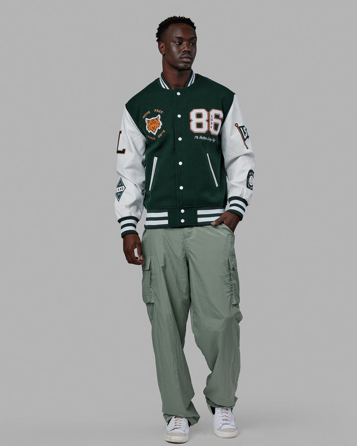 Man wearing Unisex Varsity Bomber Jacket - Vital Green