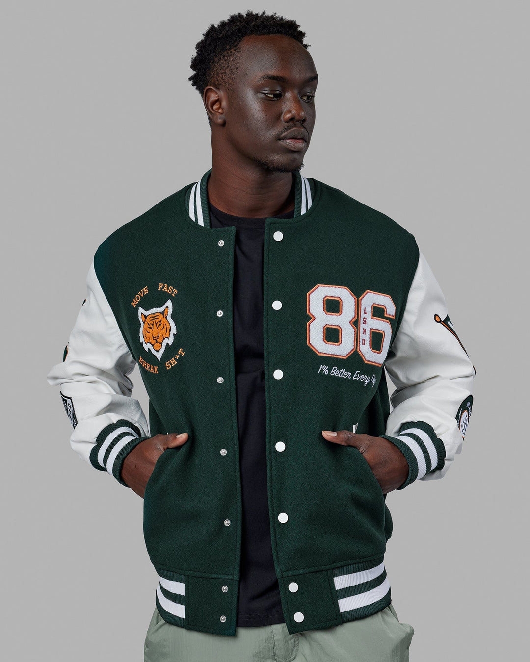 Man wearing Unisex Varsity Bomber Jacket - Vital Green
