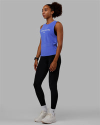Woman wearing Vital 1% Better Training Tank - Power Cobalt-White