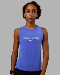 Woman wearing Vital 1% Better Training Tank - Power Cobalt-White