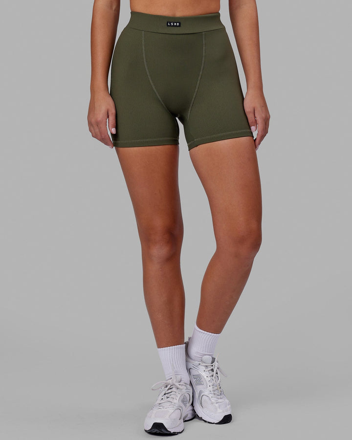 Woman wearing Vitalise Ribbed Mid Short - Forest Night