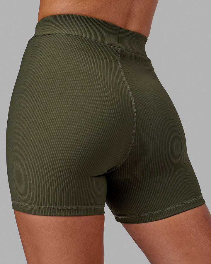 Woman wearing Vitalise Ribbed Mid Short - Forest Night