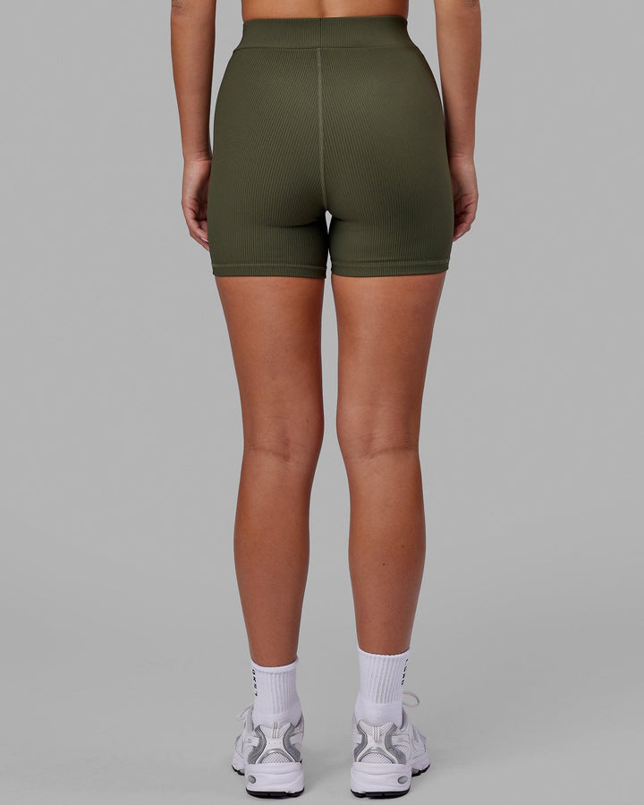 Woman wearing Vitalise Ribbed Mid Short - Forest Night