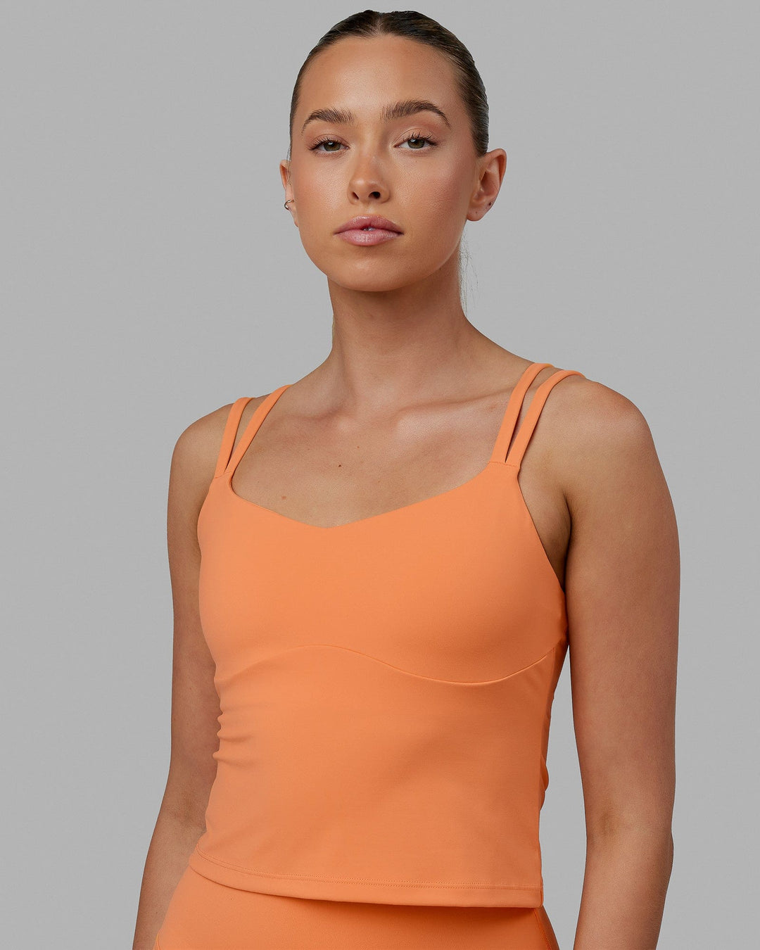 Woman wearing Vogue Shelf Bra Tank - Tangerine