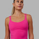 Woman wearing Vogue Shelf Bra Tank - Ultra Pink