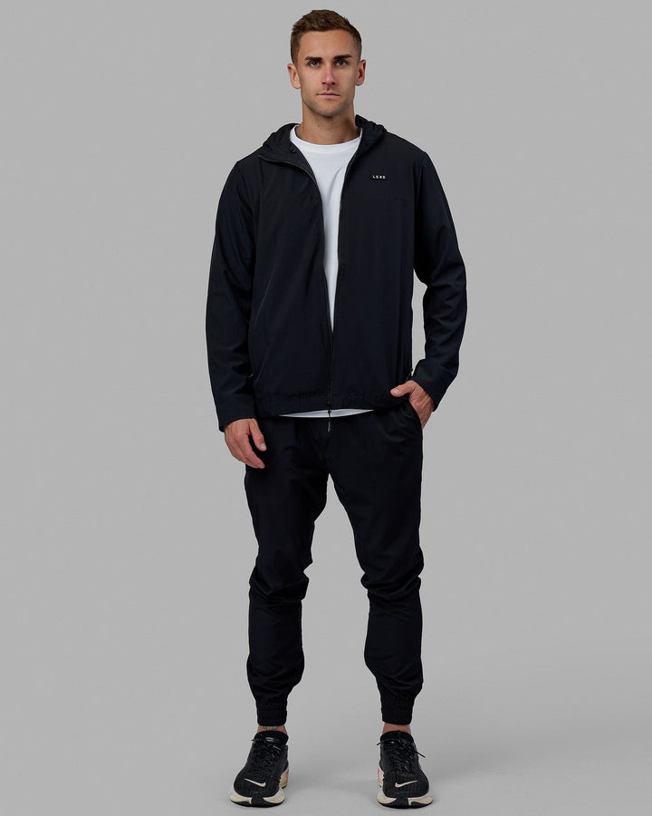 Man wearing Warm Up Zip Cuff Performance Pant - Black