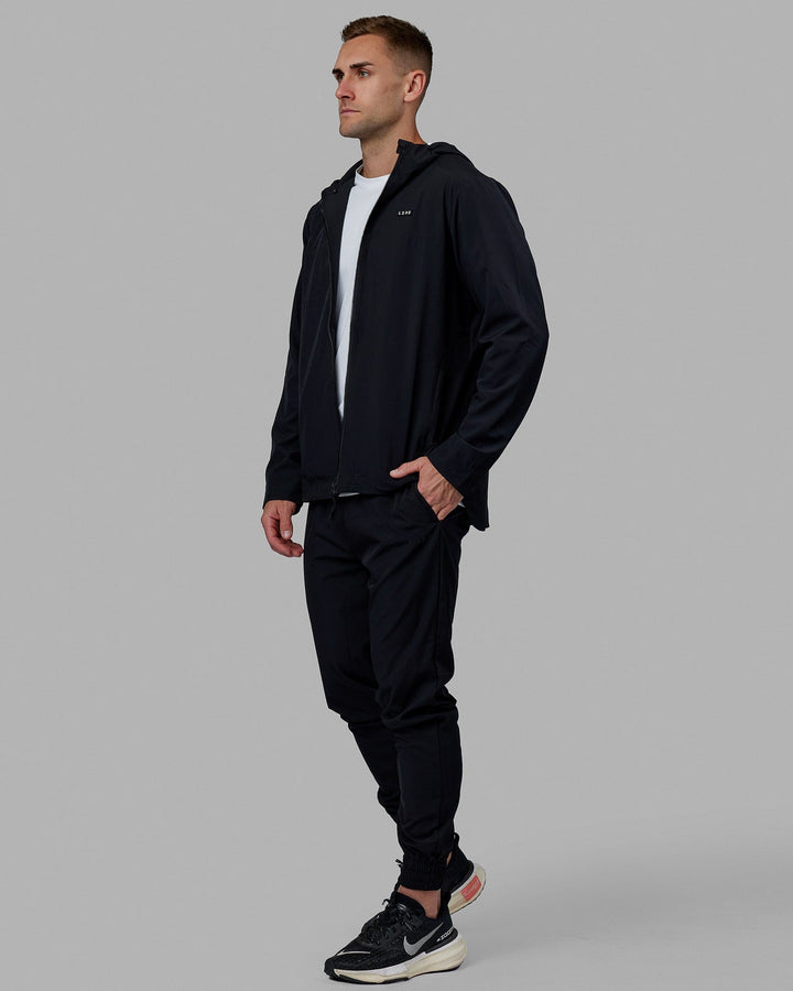 Man wearing Warm Up Zip Cuff Performance Pant - Black