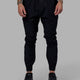 Man wearing Warm Up Zip Cuff Performance Pant - Black