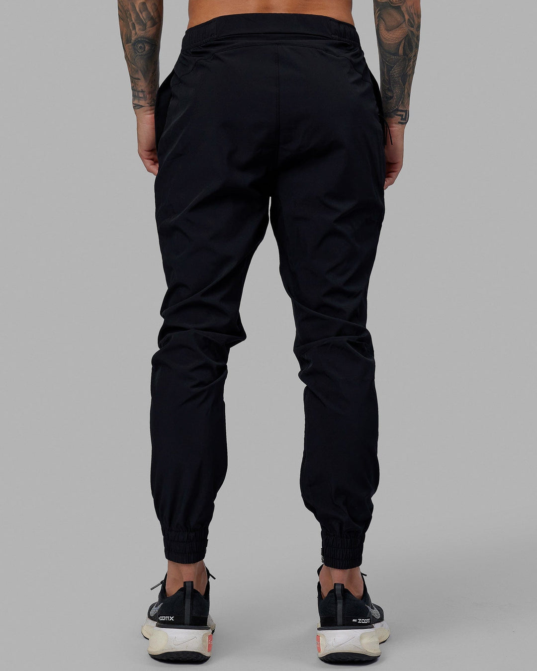 Man wearing Warm Up Zip Cuff Performance Pant - Black