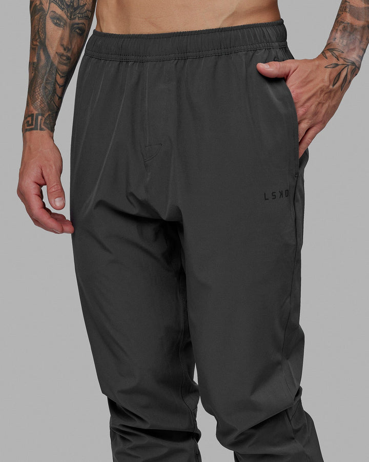 Man wearing Warm Up Zip Cuff Performance Jogger - Asphalt