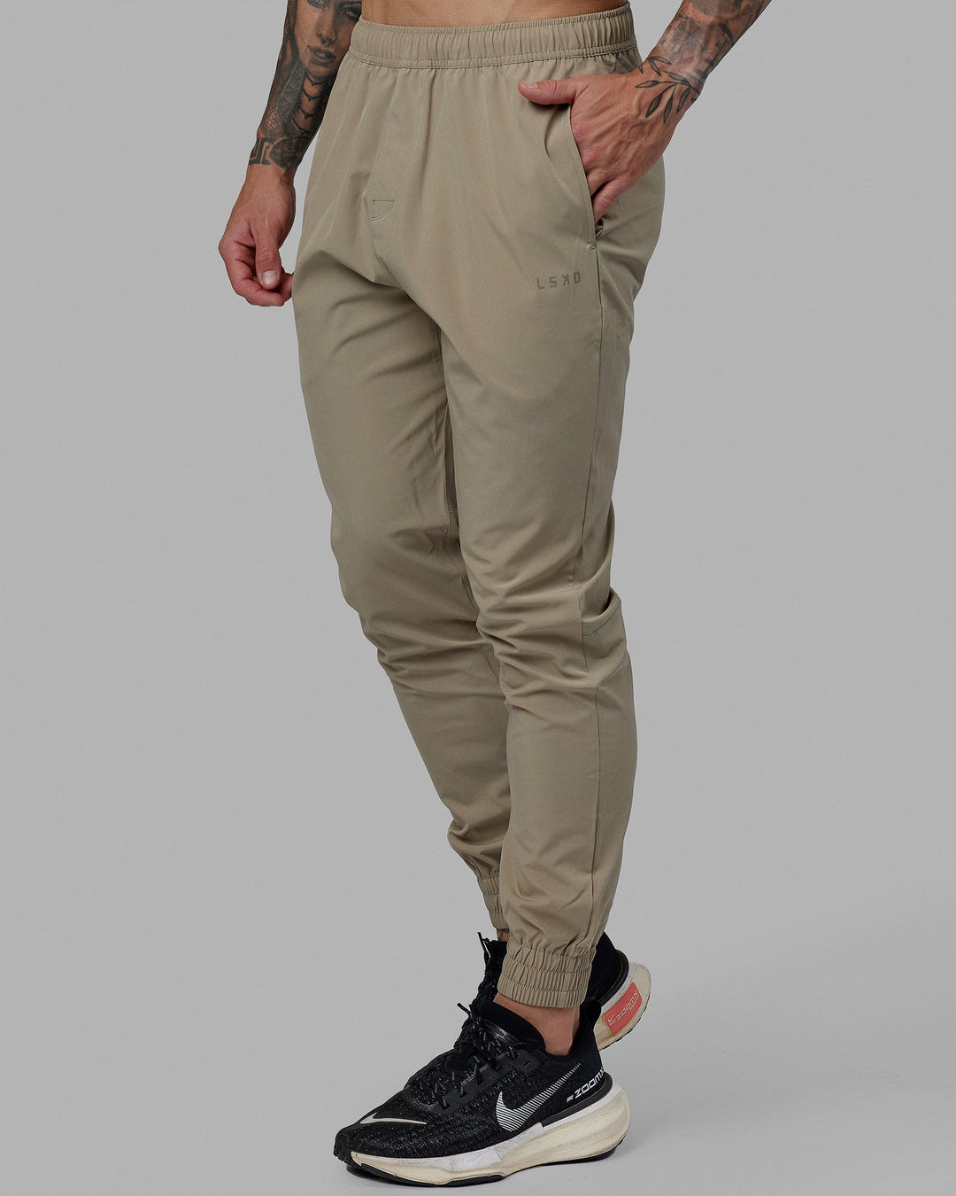 Man wearing Warm Up Zip Cuff Performance Jogger - Laurel Oak