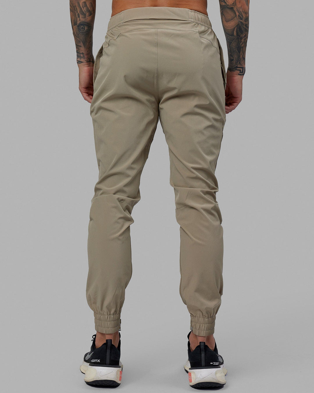 Man wearing Warm Up Zip Cuff Performance Jogger - Laurel Oak