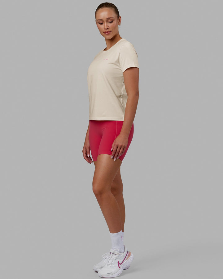 Woman wearing We Rise FLXCotton Tee - Cream