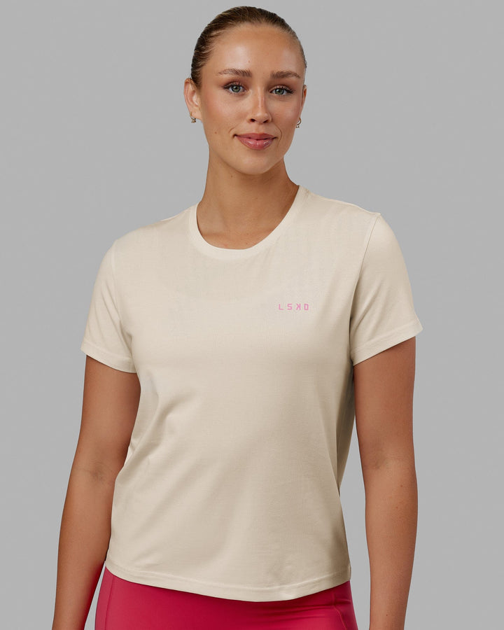 Woman wearing We Rise FLXCotton Tee - Cream