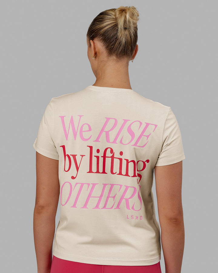 Woman wearing We Rise FLXCotton Tee - Cream