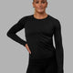 Woman wearing AeroFLX+ Seamless Long Sleeve Tee - Black Marl