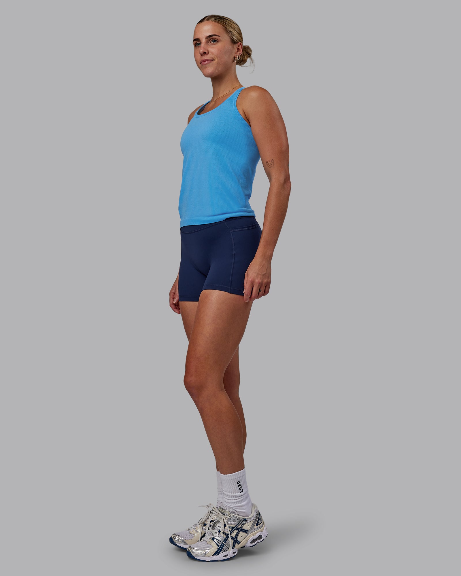 Woman wearing AeroFLX+ Seamless Tank - Azure Blue