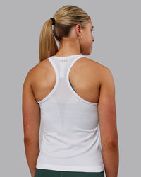 Woman wearing AeroFLX+ Seamless Tank - White | Thumbnail Index: 2