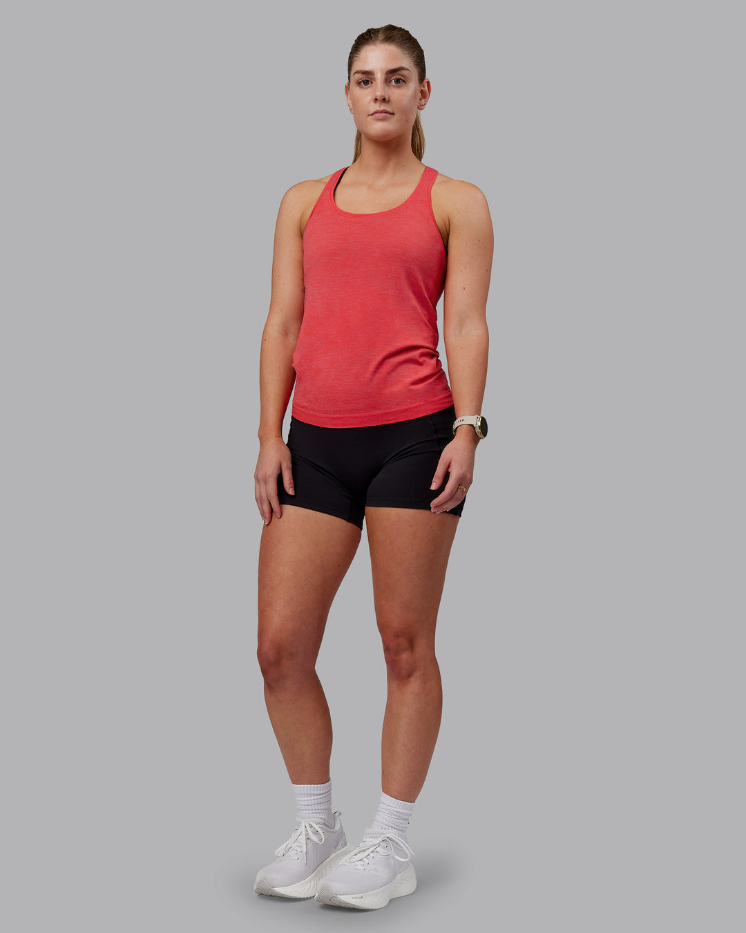 Woman wearing AeroFLX+ Seamless Tank - Fuchsia Pink-Grenadine