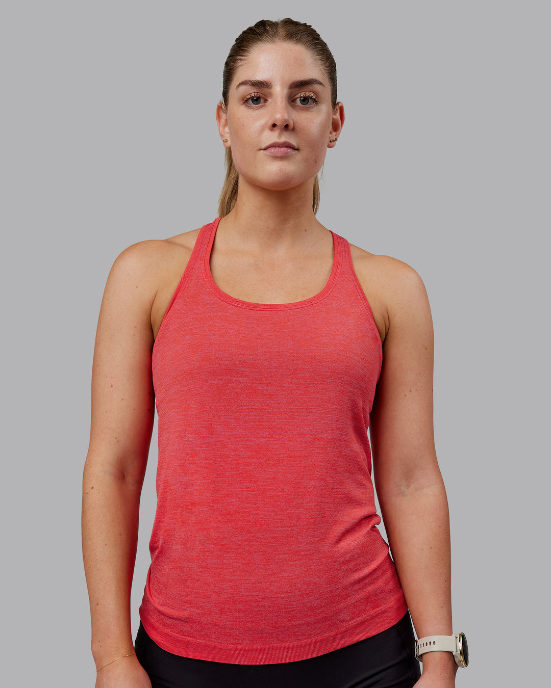 Woman wearing AeroFLX+ Seamless Tank - Fuchsia Pink-Grenadine