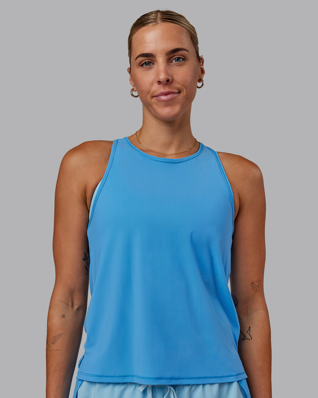 Woman wearing Cadence Tank - Azure Blue