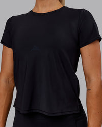 Woman wearing Cadence Tee - Black
