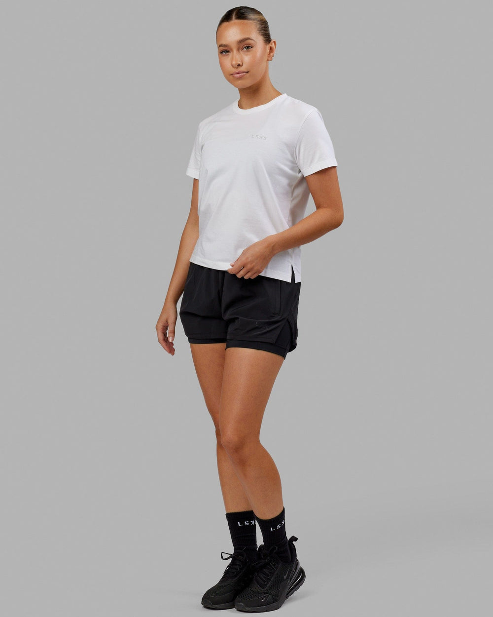 Woman wearing Deluxe PimaFLX Tee - White