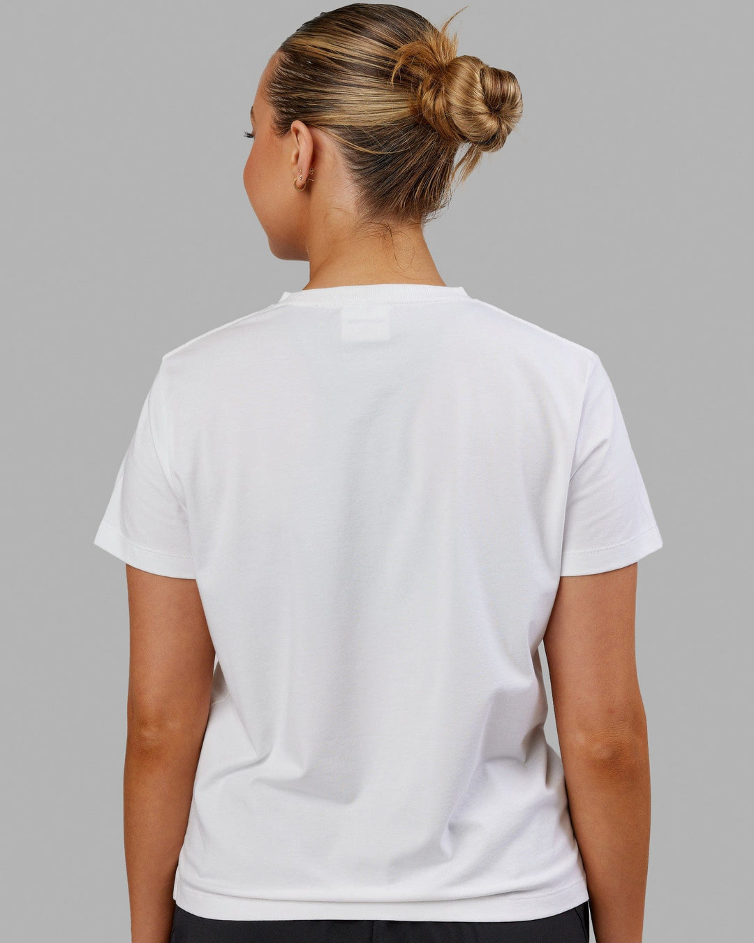 Woman wearing Deluxe PimaFLX Tee - White