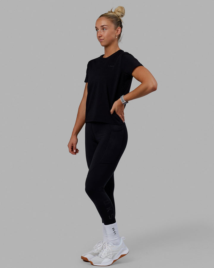 Woman wearing Endeavour FLX Cotton Tee - Black-Black