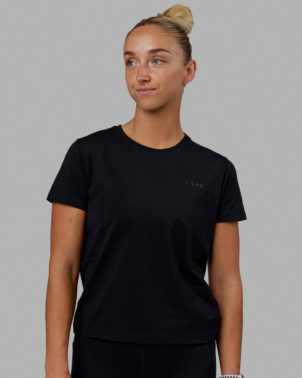 Woman wearing Endeavour FLX Cotton Tee - Black-Black