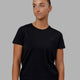 Woman wearing Endeavour FLX Cotton Tee - Black-Black