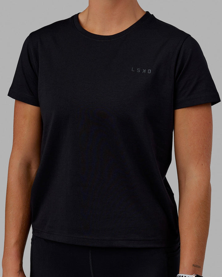 Woman wearing Endeavour FLX Cotton Tee - Black-Black