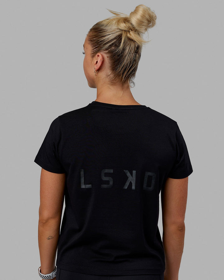 Woman wearing Endeavour FLX Cotton Tee - Black-Black