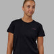 Woman wearing Endeavour FLX Cotton Tee - Black-Magenta
