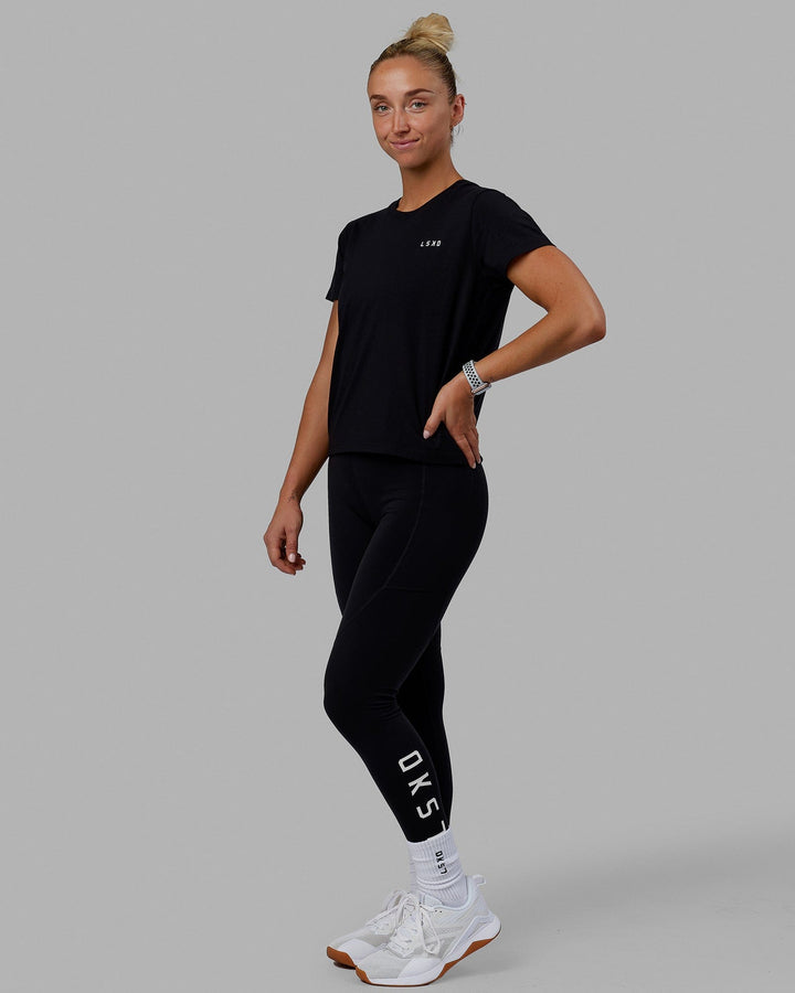 Woman wearing Endeavour FLX Cotton Tee - Black-White
