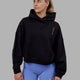 Woman wearing Good Times Global Heavyweight Hoodie - Black Purple