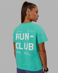 Woman wearing Love The Run FLXCotton Tee - Aquatic Awe-White