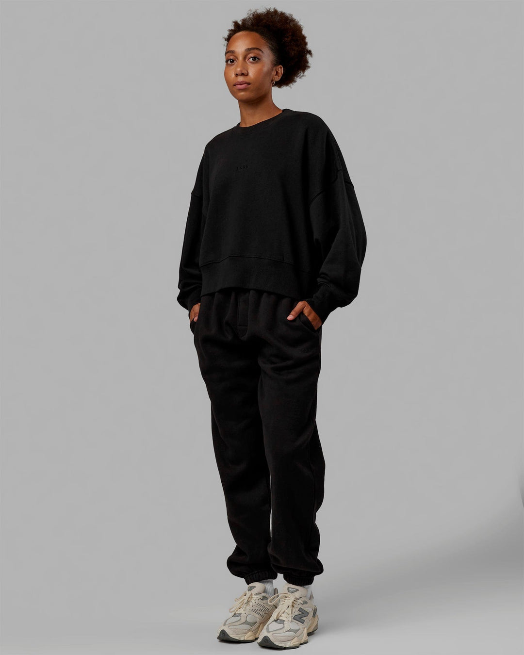 Woman wearing MVP Track Pants - Black-Black