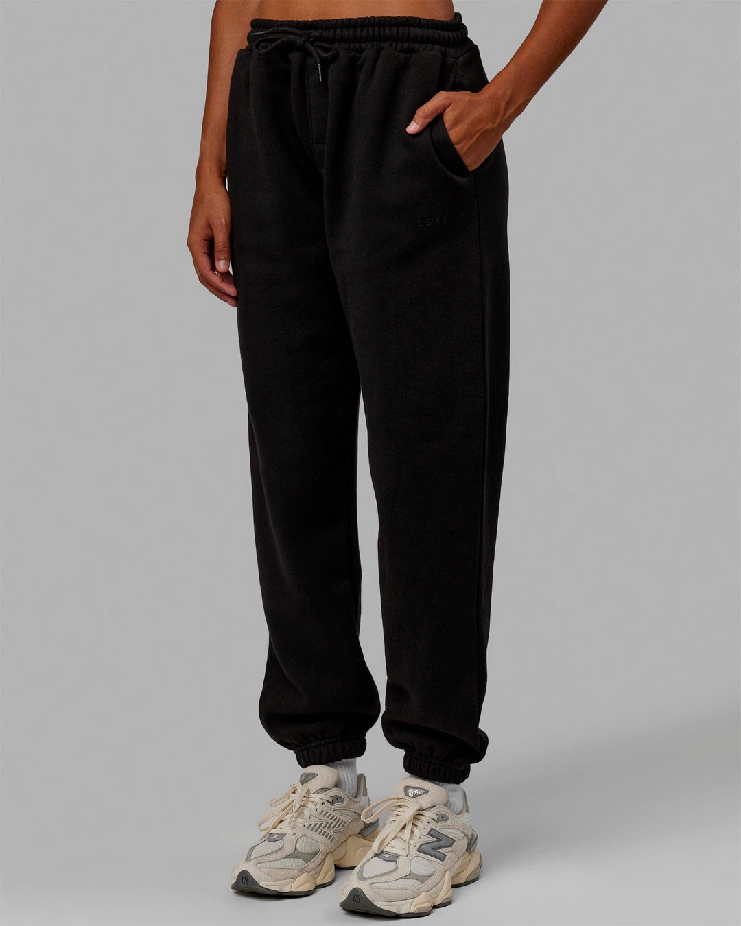 Woman wearing MVP Track Pants - Black-Black