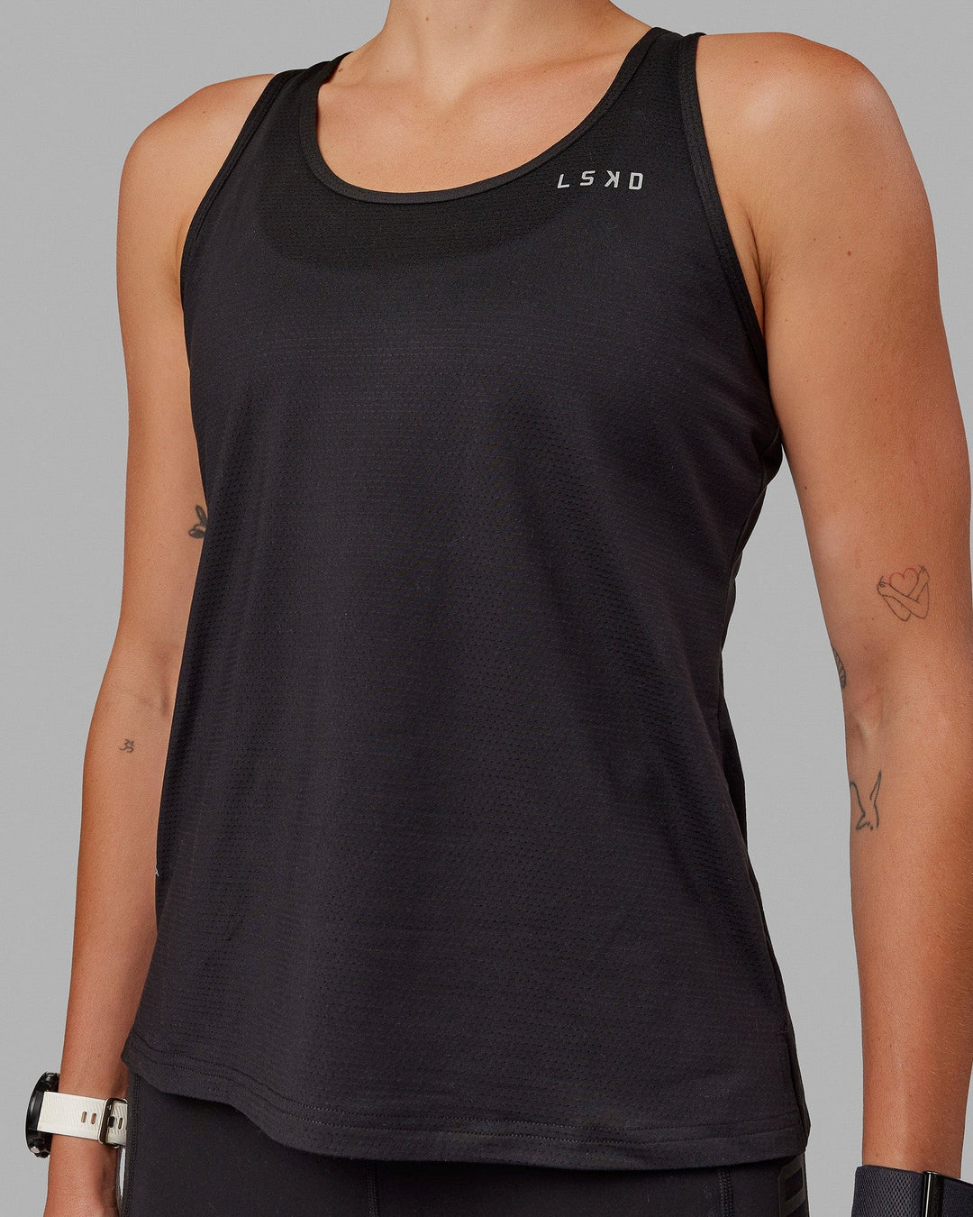 Woman wearing Perform VapourFLX Tank - Black