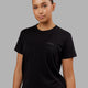 Woman wearing Deluxe PimaFLX Tee - Black