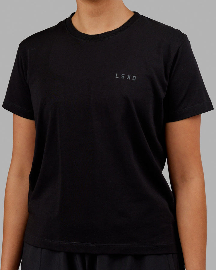 Woman wearing Deluxe PimaFLX Tee - Black
